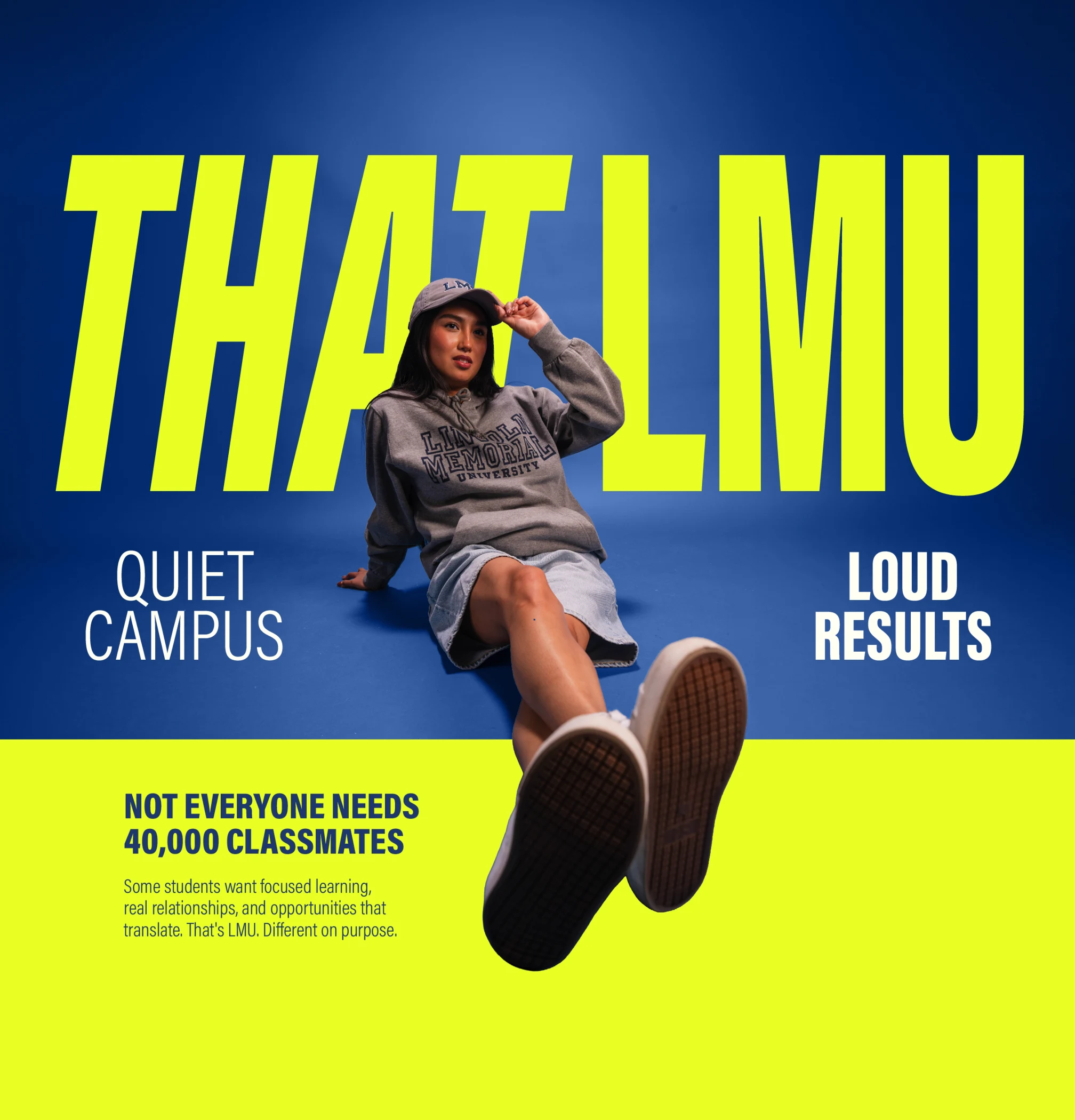 LMU student seated in front of That LMU, quiet campus, loud results artwork